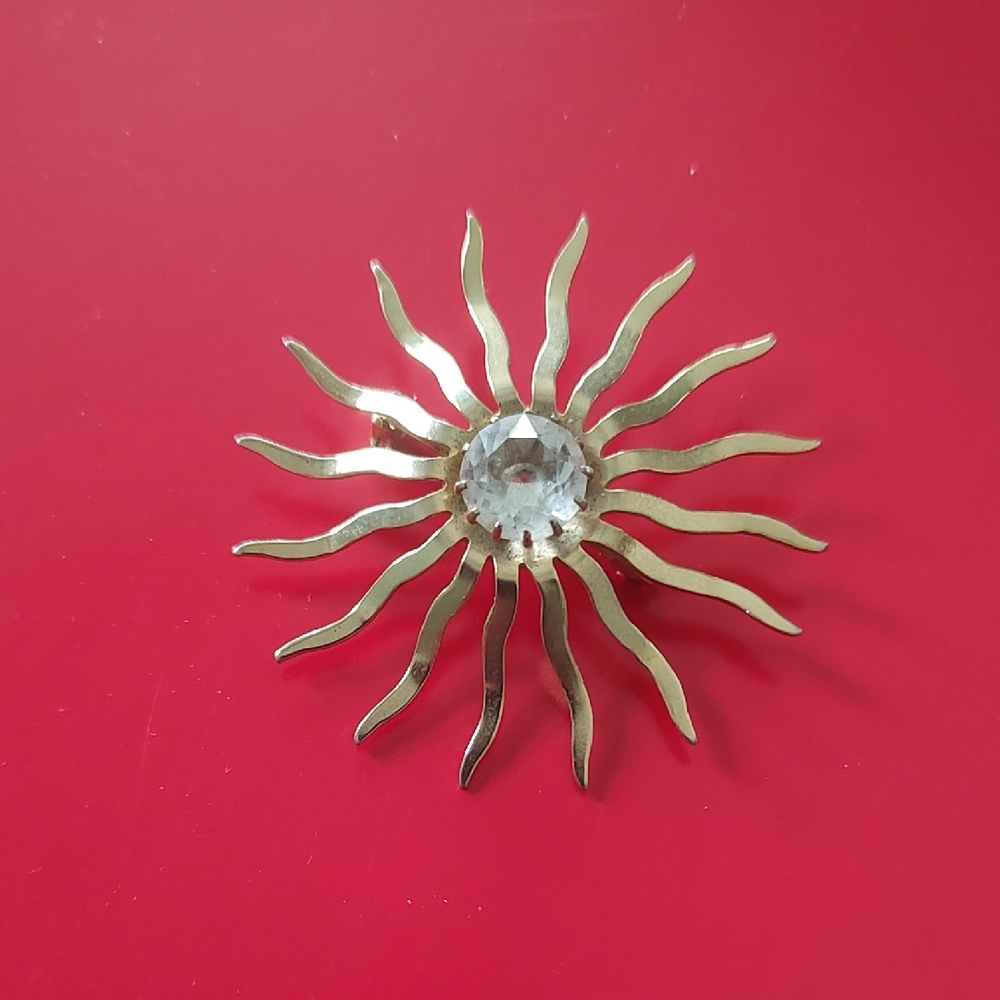 Gold Sunburst Brooch with Crystal Center